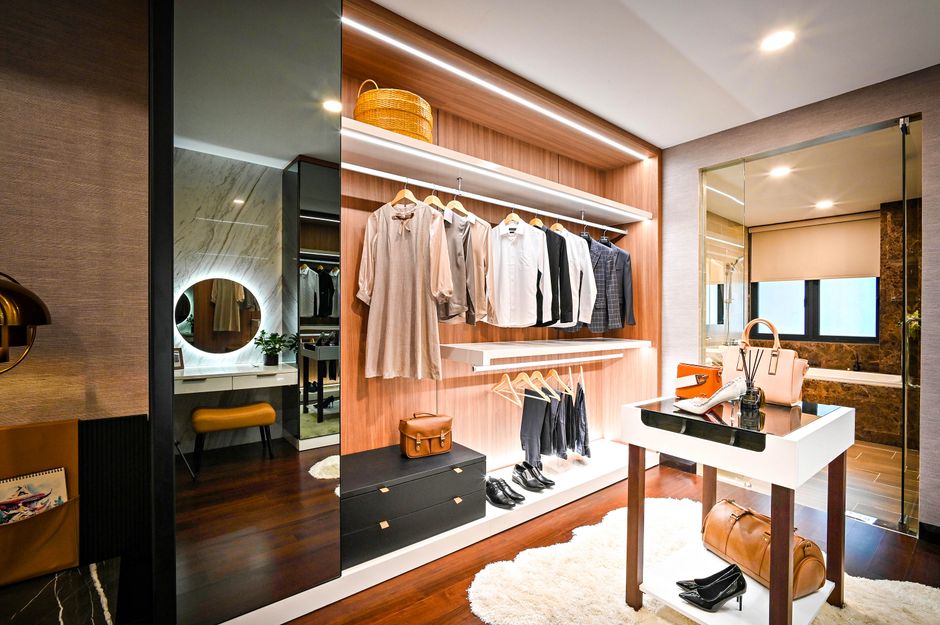 Luxury walk in closet with elegant lighting